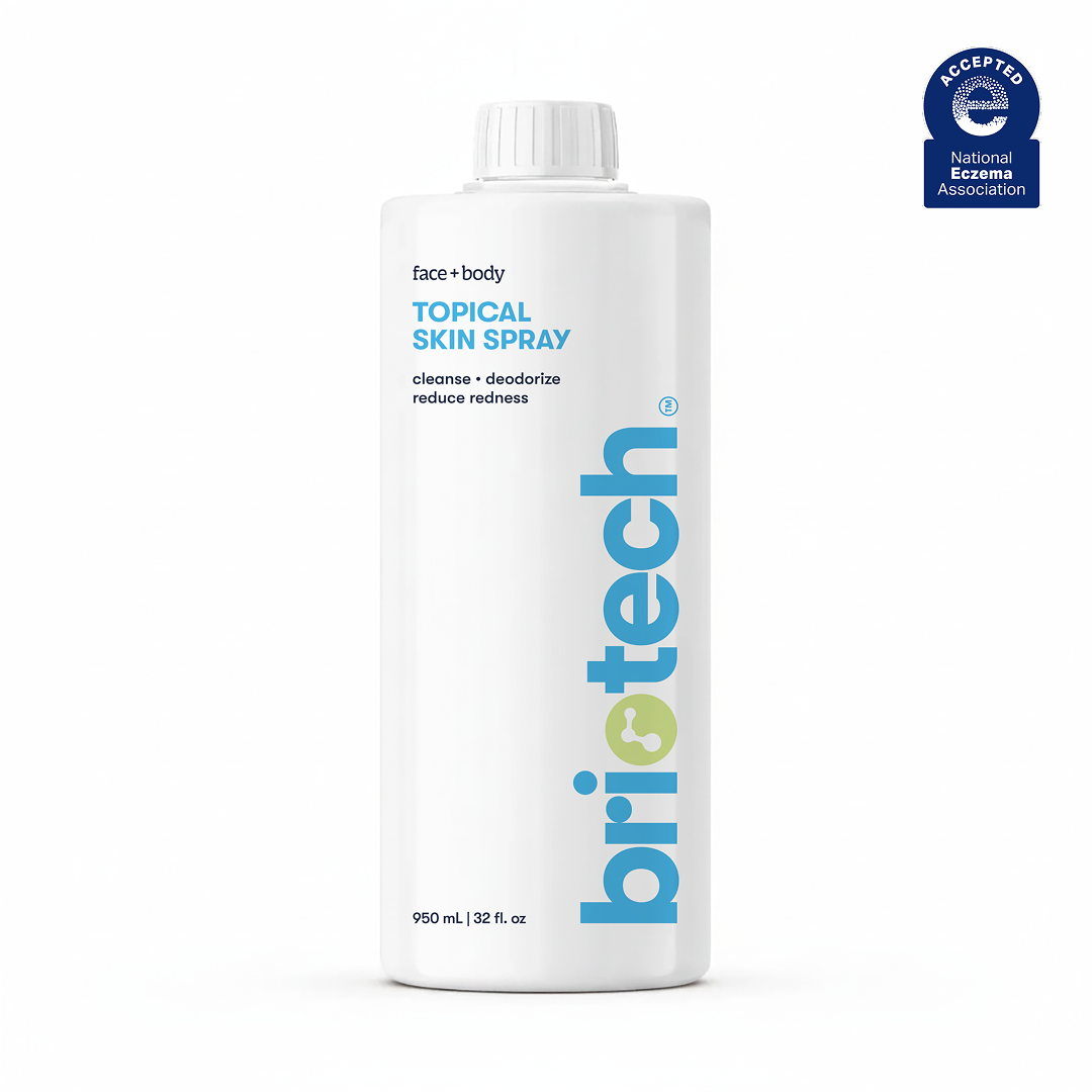 A 950 mL (32 fl oz) white bottle of Briotech Topical Skin Spray for face and body, featuring blue and gray text. This soothing spray cleanses, deodorizes, reduces redness, and calms irritation.