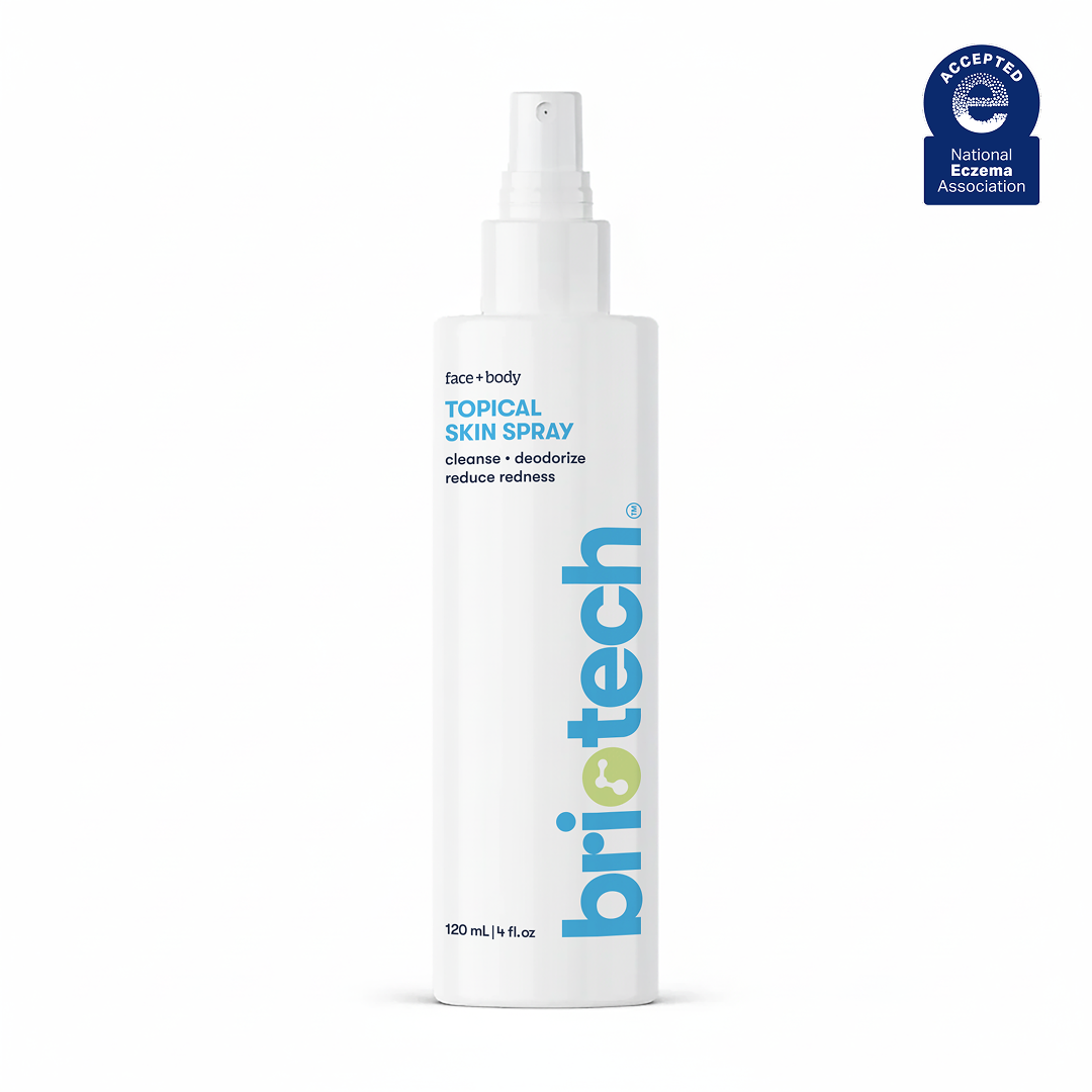 A white spray bottle labeled briotech stands upright. The label reads Topical Skin Spray—a soothing spray to cleanse, deodorize, calm irritation, and reduce redness, with a 120 mL (4 fl. oz.) capacity.