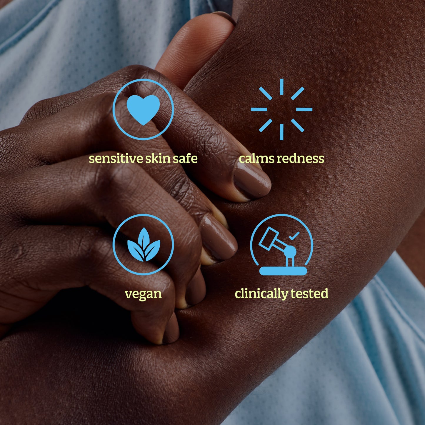 A close-up shows someone holding their arm with four icons and labels: soothes irritation (heart), reduces redness (rays), vegan (leaves), and clinically tested Topical Skin Spray (lab flask).