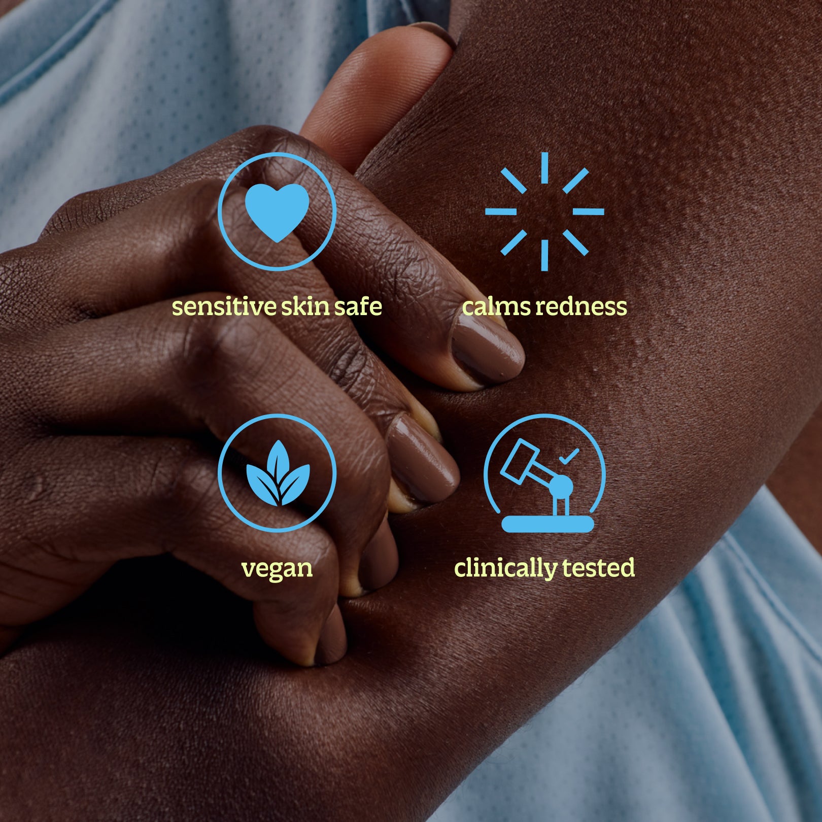 A close-up shows someone holding their arm with four icons and labels: soothes irritation (heart), reduces redness (rays), vegan (leaves), and clinically tested Topical Skin Spray (lab flask).